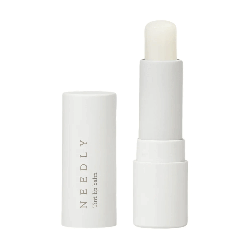 confezione di lip balm senza tappo in cui si vede la texture e il colore dello stesso, il colore è neutro